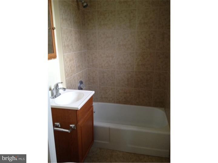 222 North Miller Street, Unit 1 Shillington, PA 19607 - Photo 5 of 5 a bathroom with a sink and a bathtub