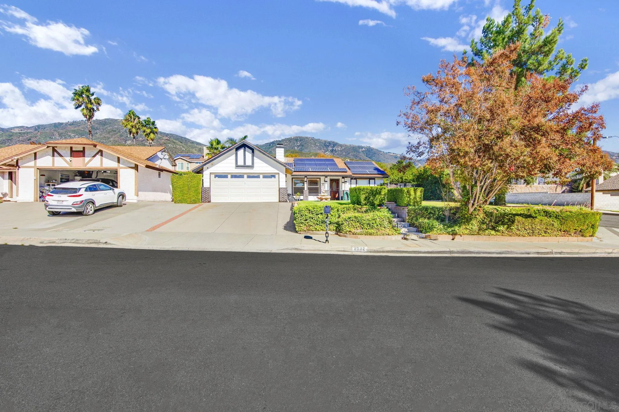 2772 Cincinnati Street West San Bernardino, CA 92407 - Photo 2 of 41 a front view of a house with a yard and garage