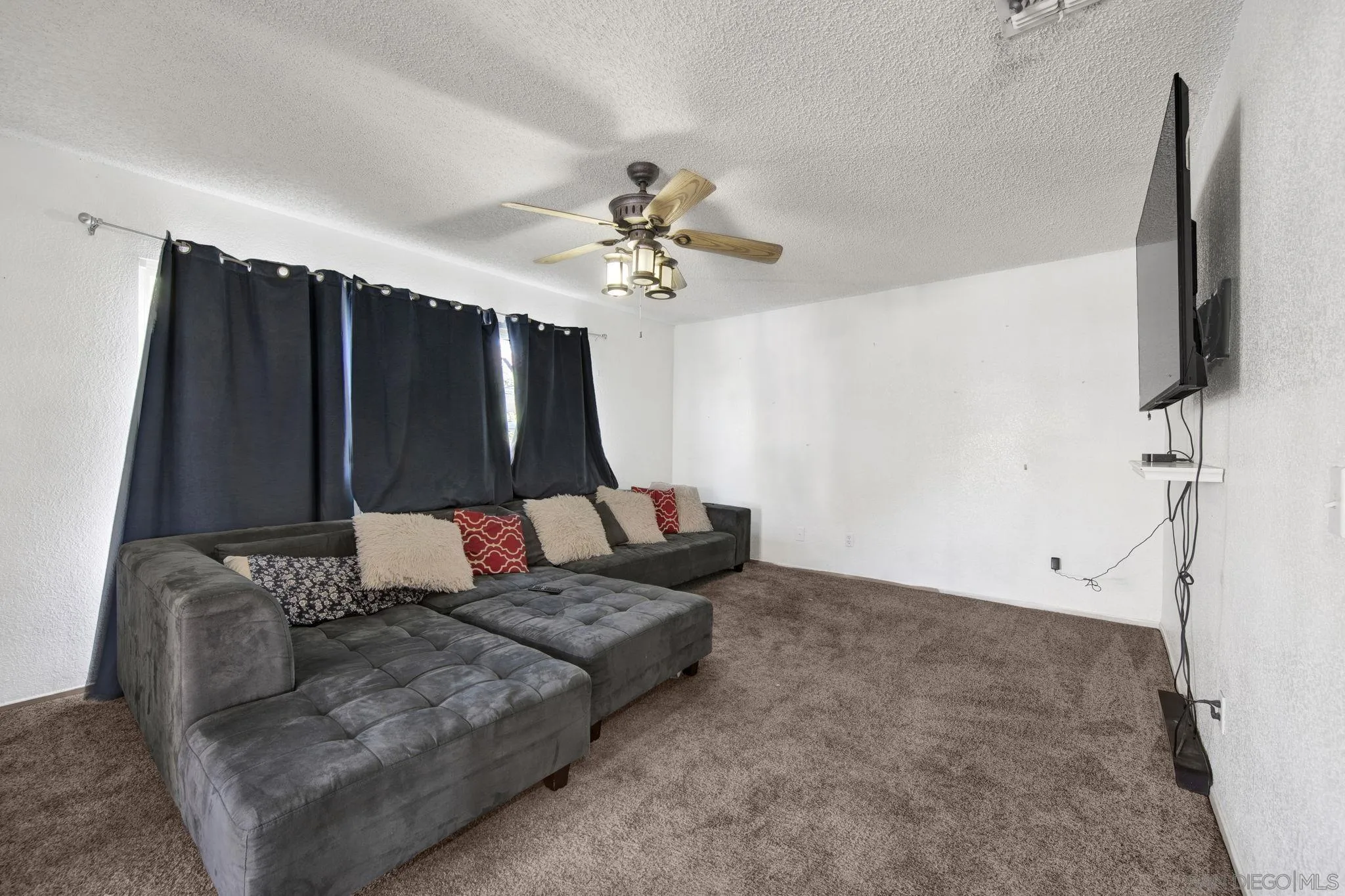 2772 Cincinnati Street West San Bernardino, CA 92407 - Photo 24 of 41 a living room with furniture and a flat screen tv