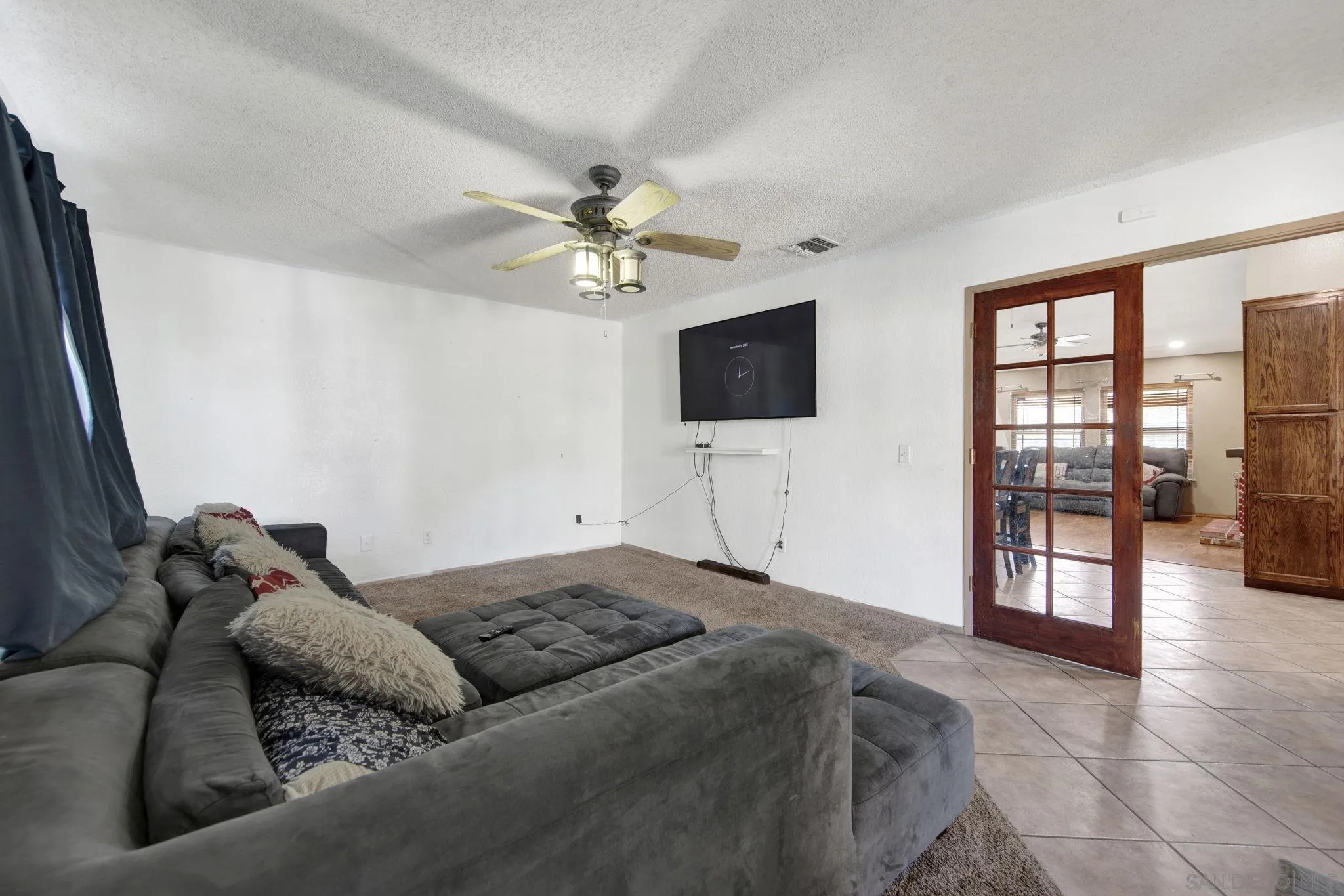 2772 Cincinnati Street West San Bernardino, CA 92407 - Photo 25 of 41 a living room with furniture and a flat screen tv