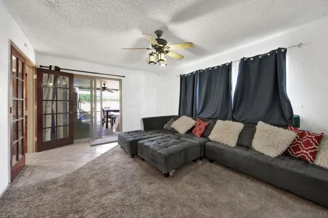 a living room with furniture and a window