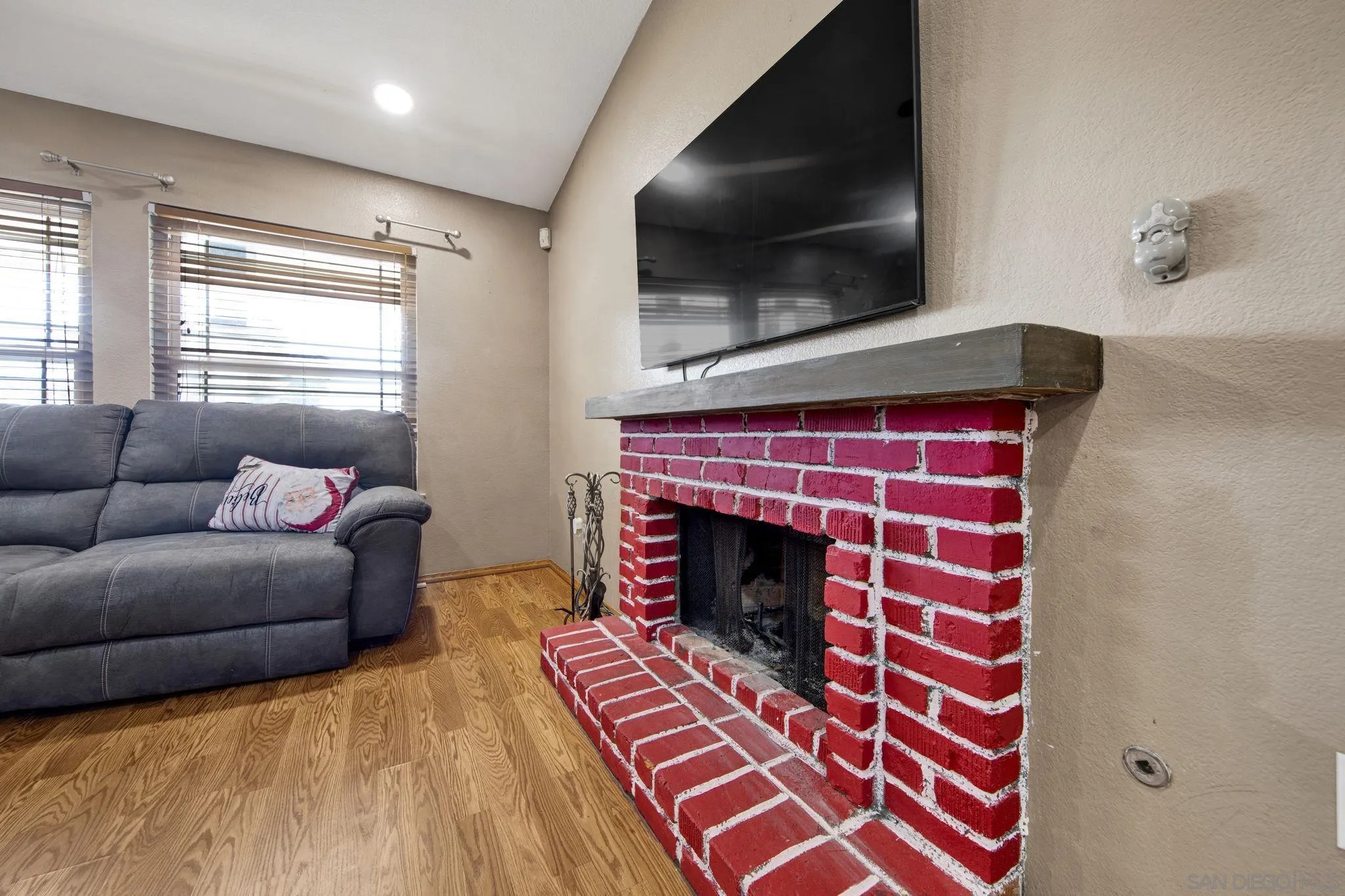 2772 Cincinnati Street West San Bernardino, CA 92407 - Photo 27 of 41 a living room with furniture and a fireplace