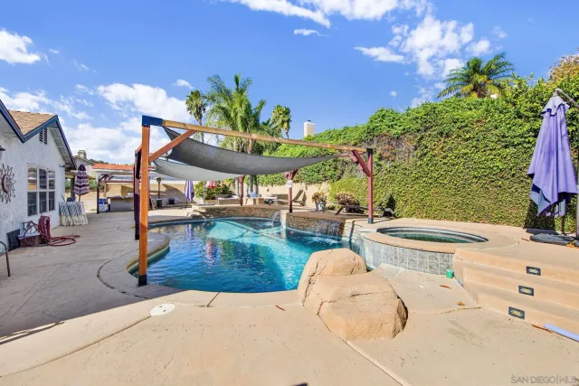 a view of a swimming pool with a patio