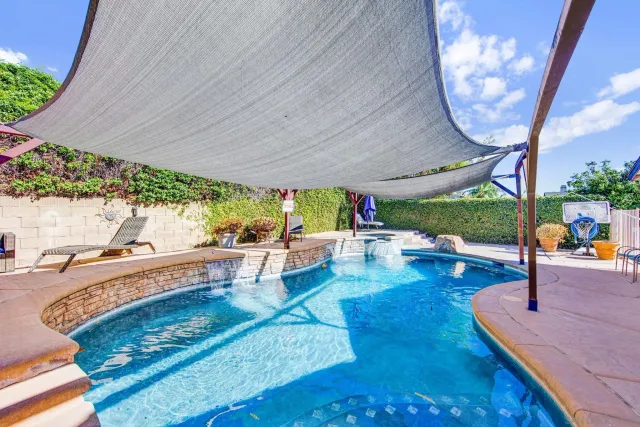 a view of a swimming pool with a patio
