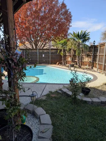 a view of swimming pool with outdoor seating