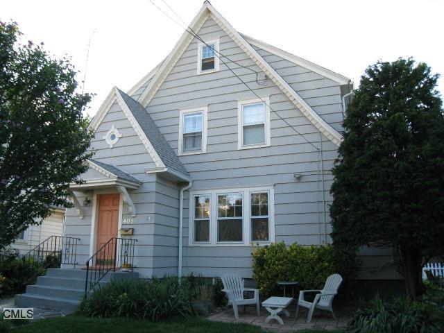 401 Grovers Avenue Bridgeport, CT 06605 - Photo 1 of 1 a view of backyard with table and chairs and potted plants