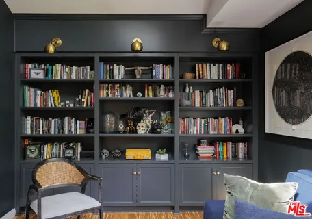a view of a workspace with bookshelf