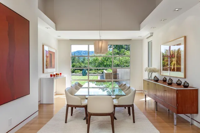 a dining room with furniture and window