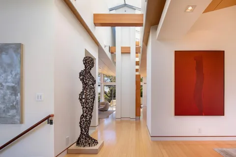 a view of a hallway with windows