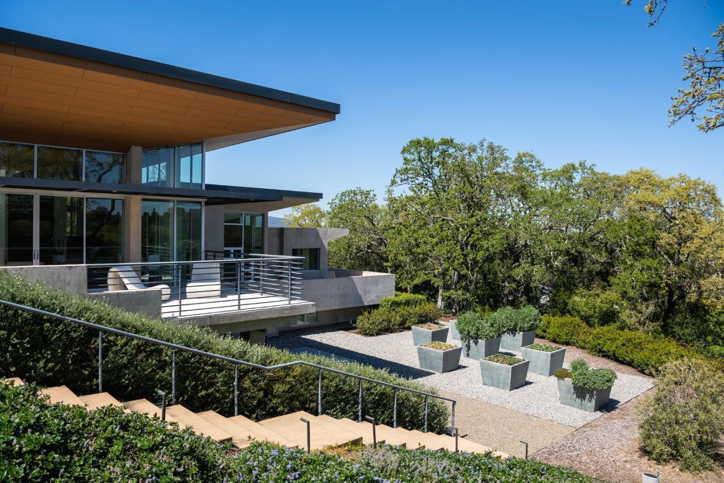 1 Grove Court Portola Valley, CA 94028 - Photo 37 of 43 a view of a house with backyard sitting area and swimming pool