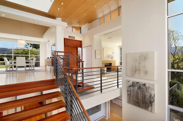 a view of living room kitchen and a wooden floor