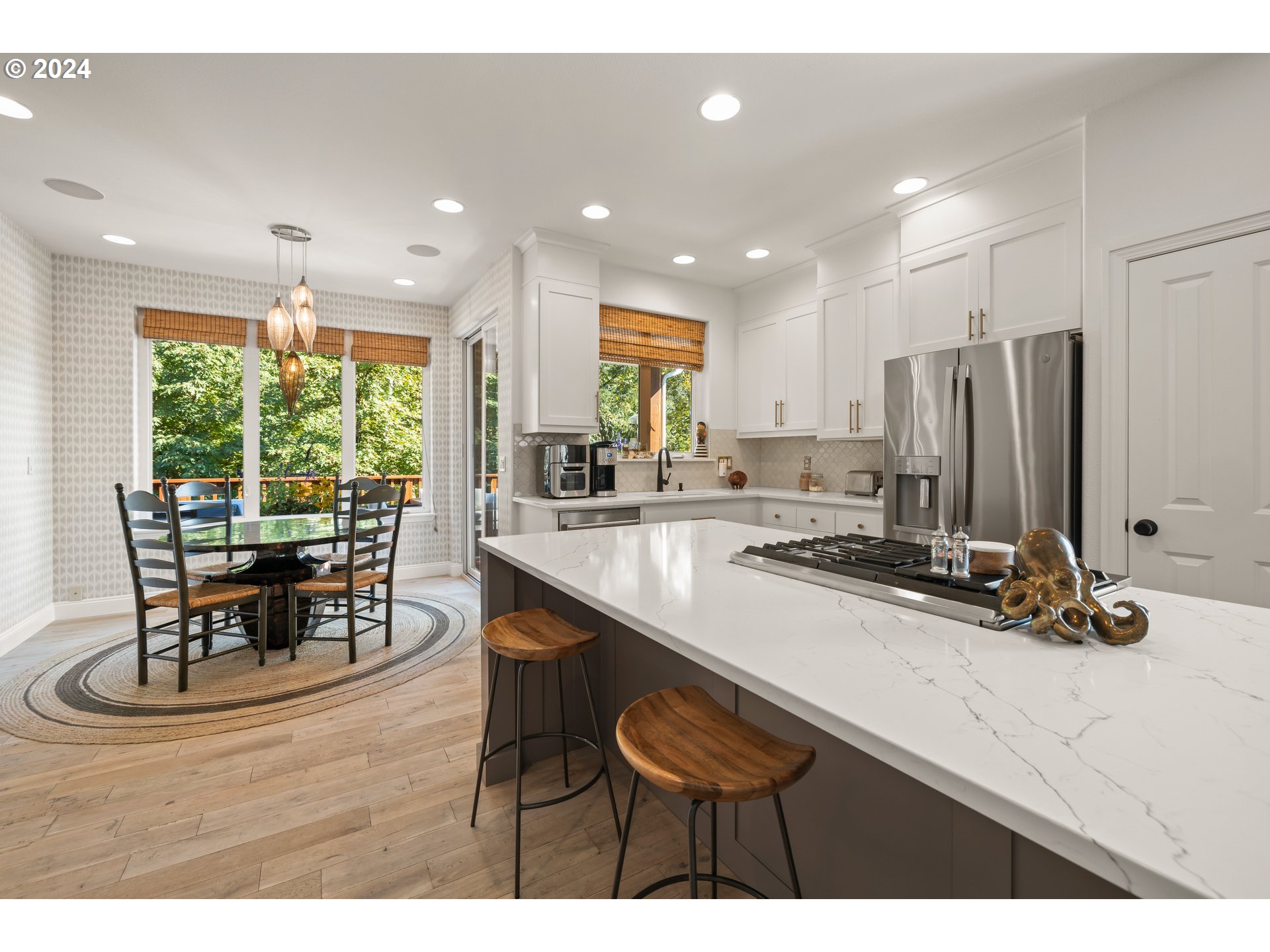 2534 Northwest Rhodes Lane Portland, OR 97229 - Photo 14 of 41 a view of kitchen with kitchen island dining table and chairs