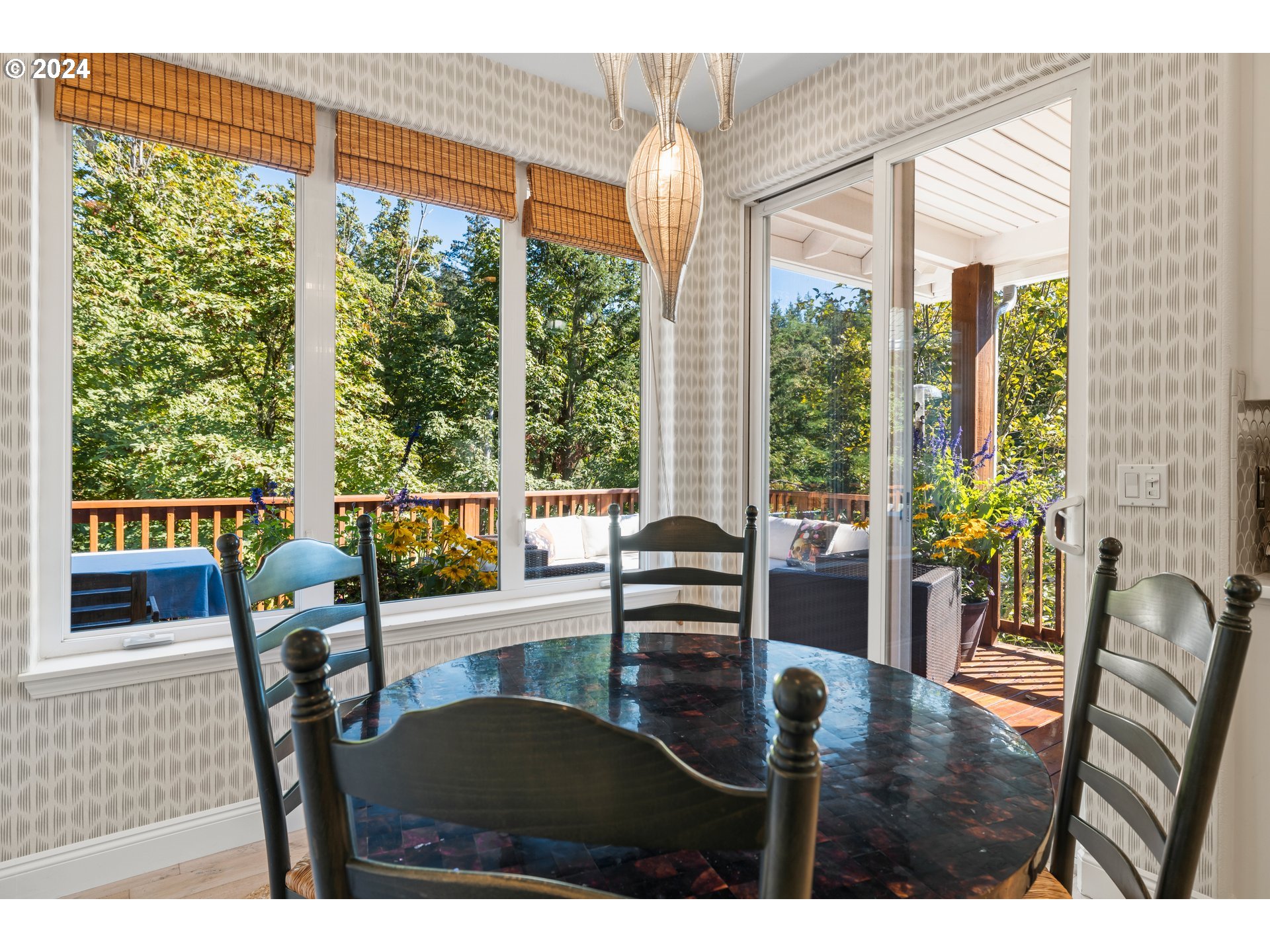 2534 Northwest Rhodes Lane Portland, OR 97229 - Photo 15 of 41 a view of a dining room with furniture window and wooden floor