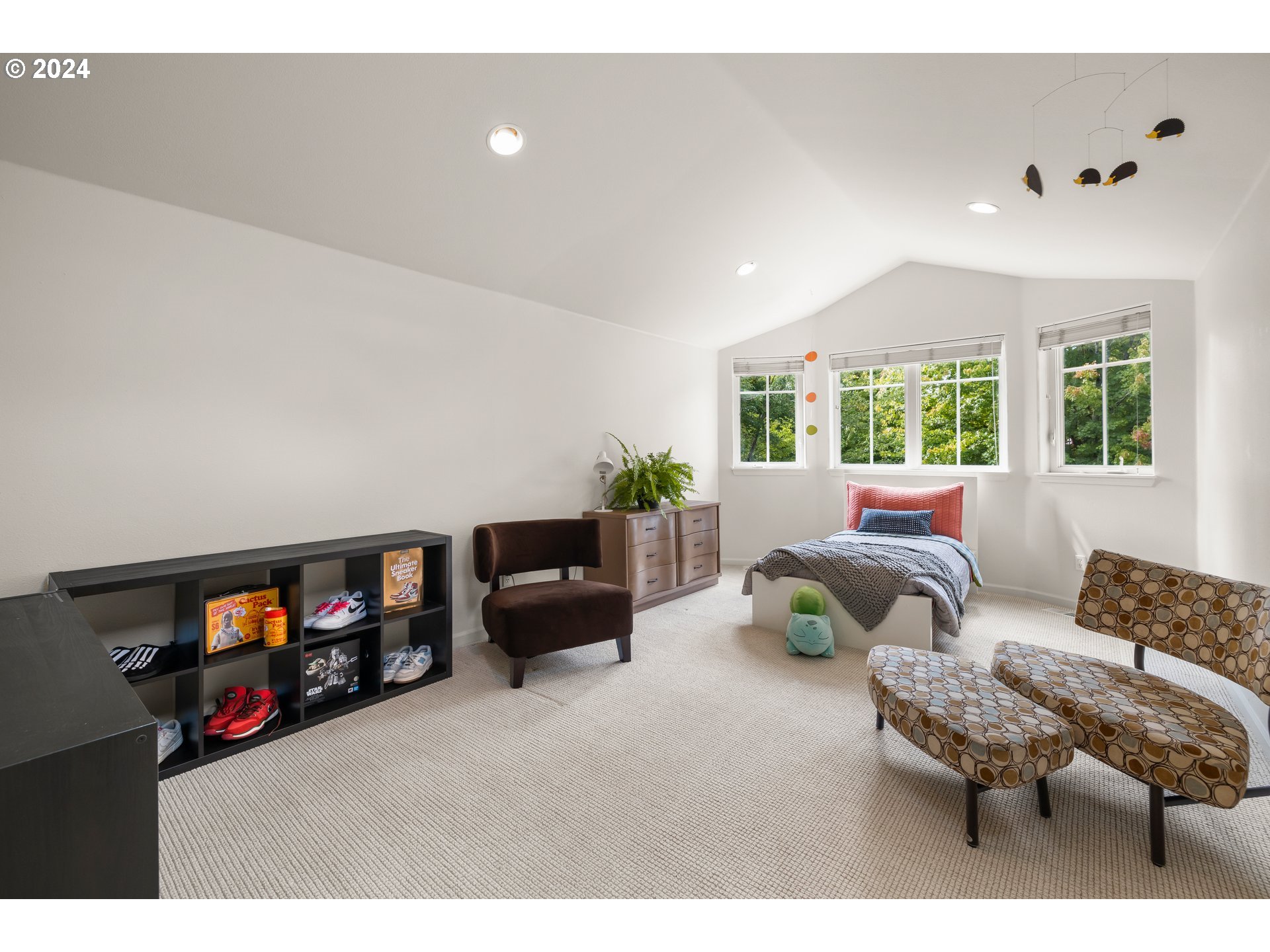 2534 Northwest Rhodes Lane Portland, OR 97229 - Photo 16 of 41 a living room with furniture and a flat screen tv