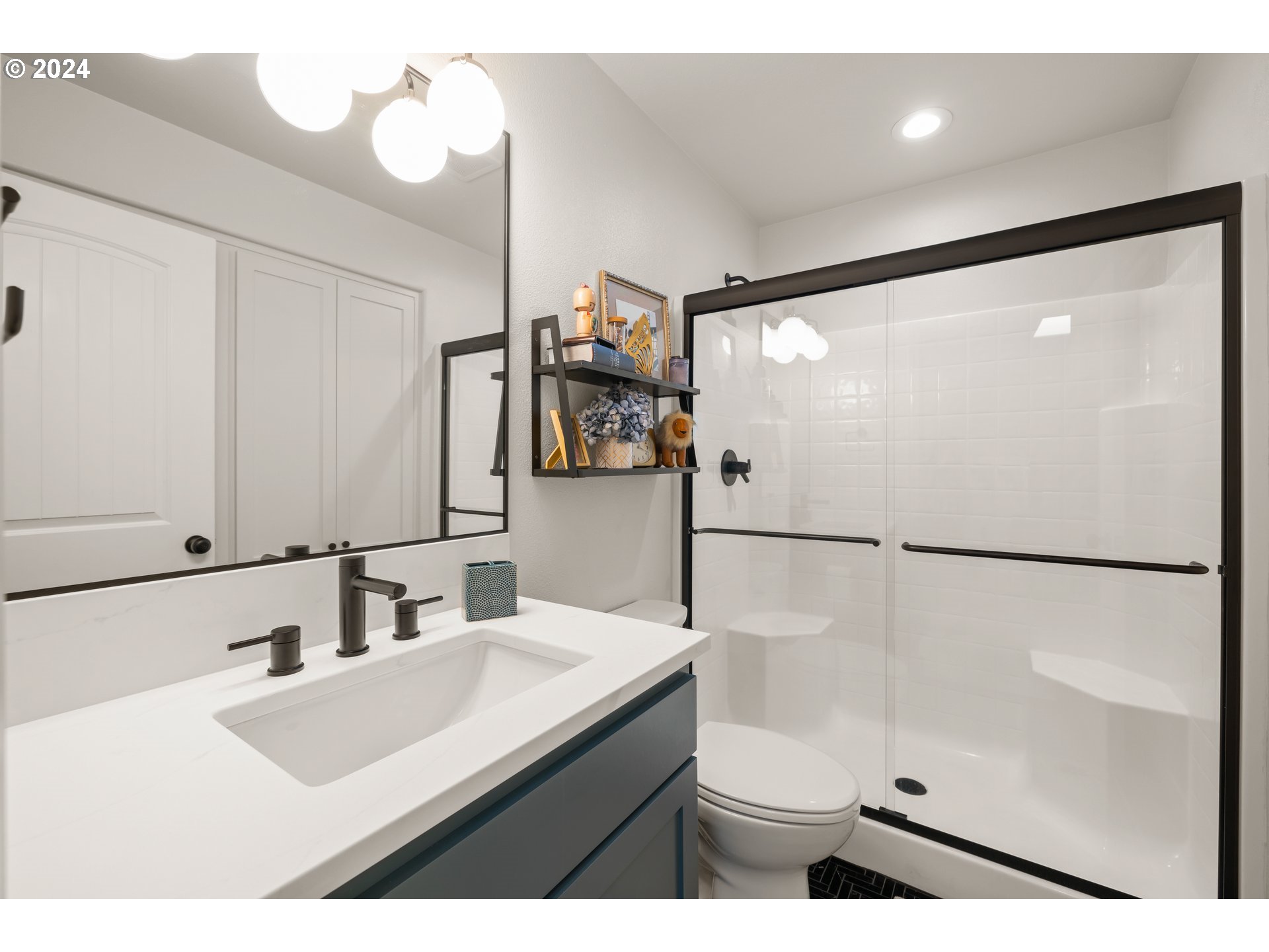 2534 Northwest Rhodes Lane Portland, OR 97229 - Photo 18 of 41 a bathroom with a sink and a mirror