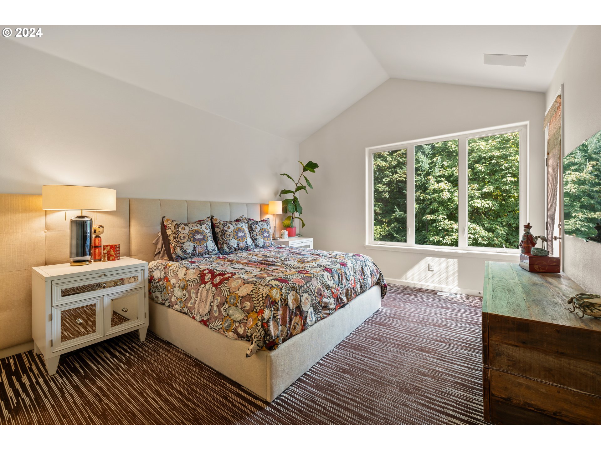 2534 Northwest Rhodes Lane Portland, OR 97229 - Photo 21 of 41 a bedroom with a bed and a large window