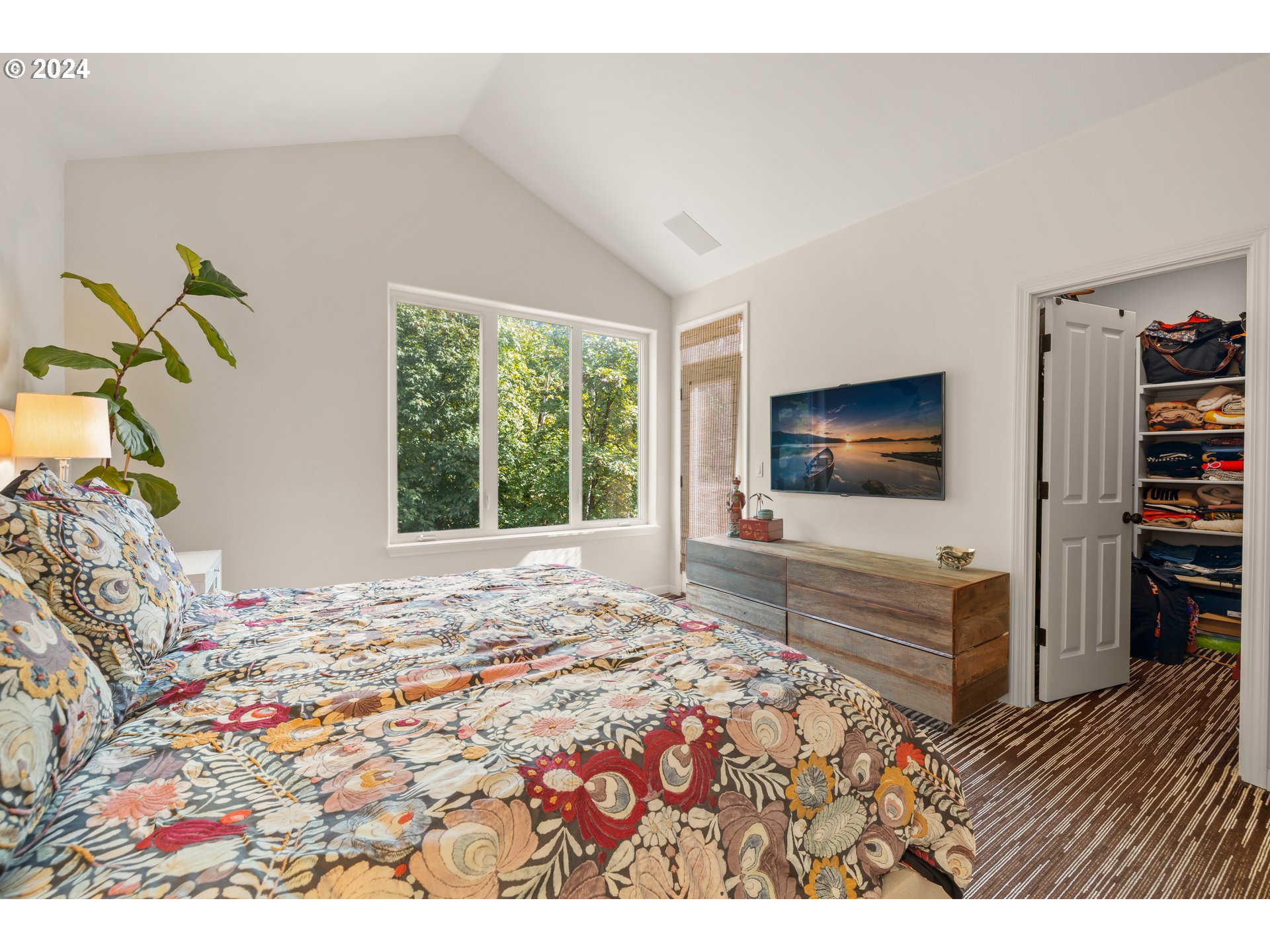 2534 Northwest Rhodes Lane Portland, OR 97229 - Photo 22 of 41 a bedroom with a bed and a flat screen tv