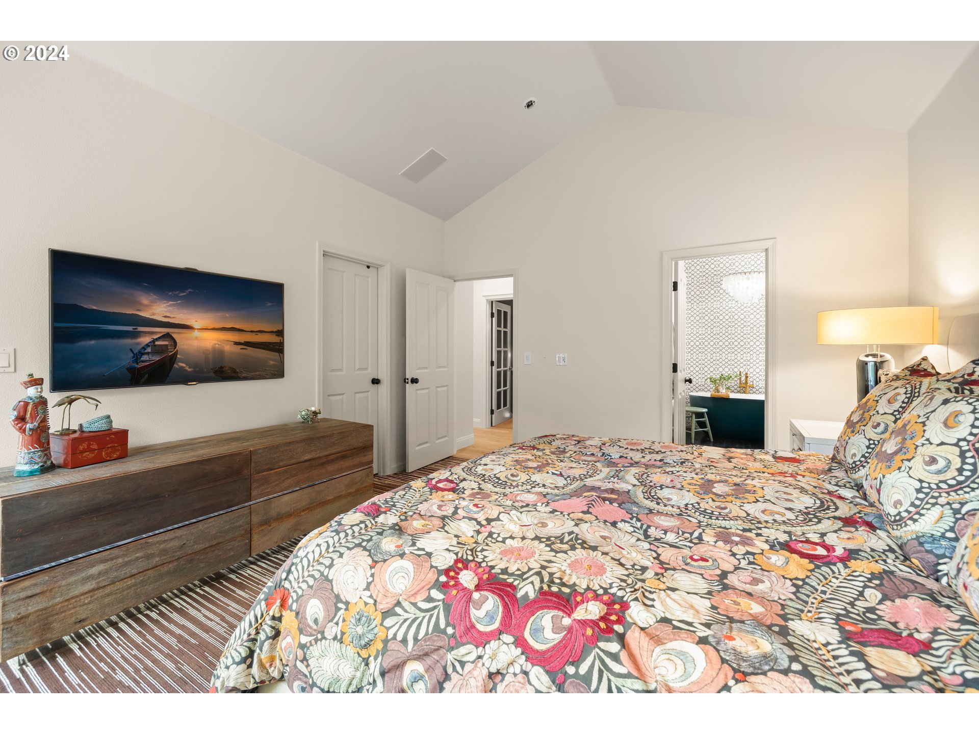 2534 Northwest Rhodes Lane Portland, OR 97229 - Photo 23 of 41 a bedroom with a bed and a flat screen tv