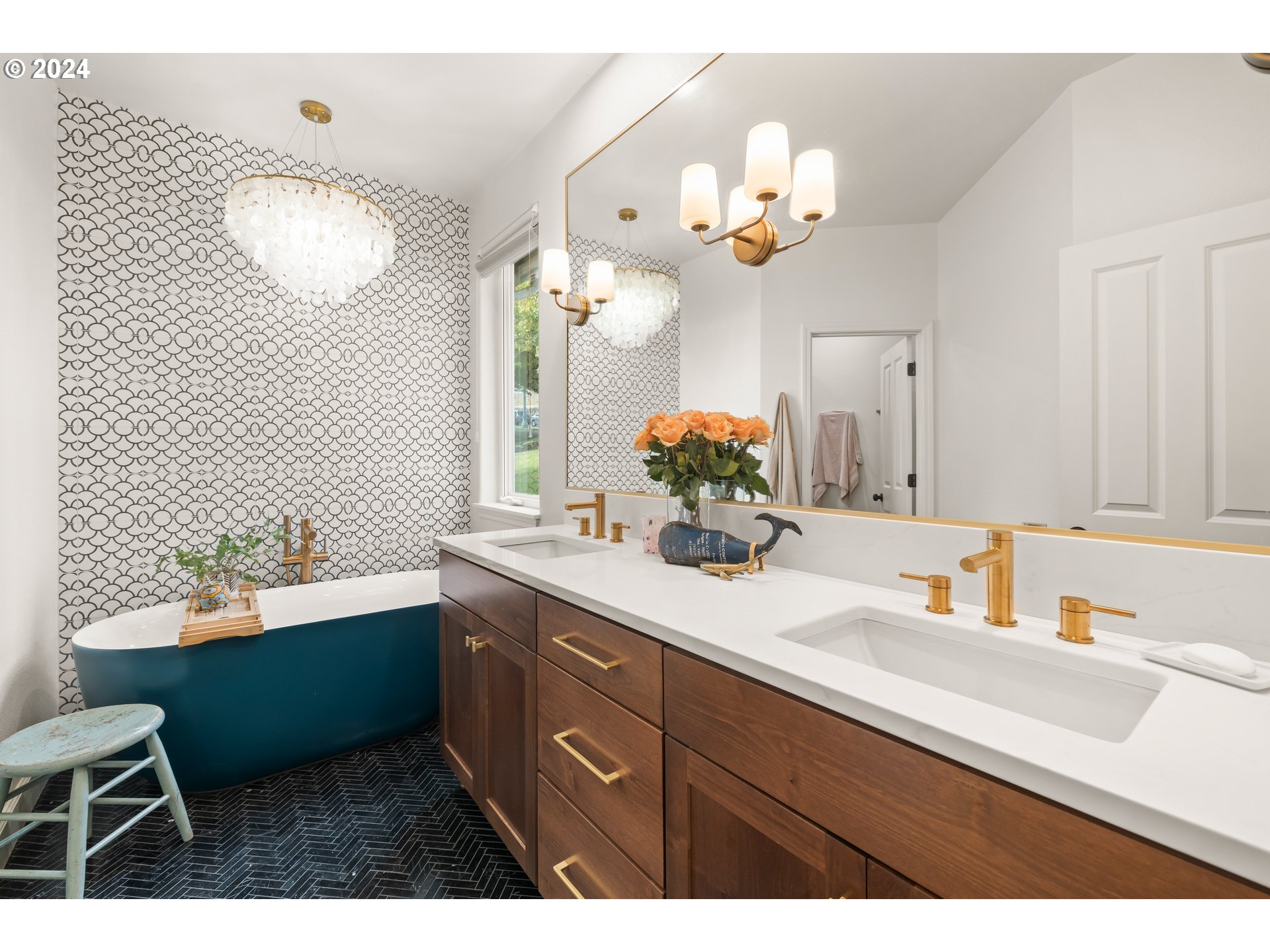 2534 Northwest Rhodes Lane Portland, OR 97229 - Photo 24 of 41 a bathroom with a sink a large mirror and a window