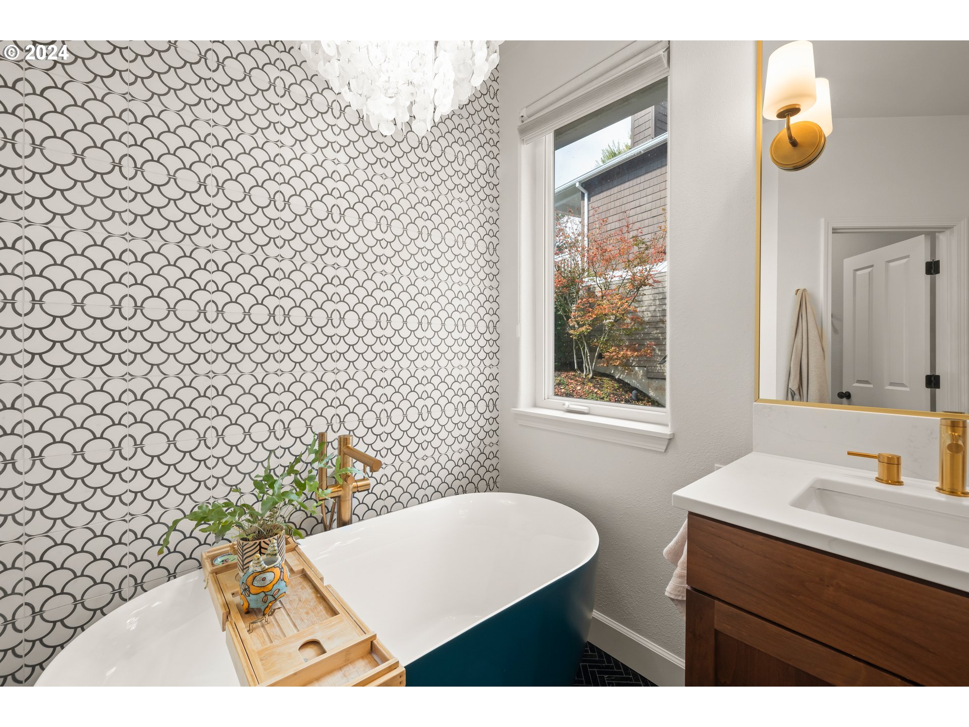 2534 Northwest Rhodes Lane Portland, OR 97229 - Photo 27 of 41 a bathroom with a sink and a mirror