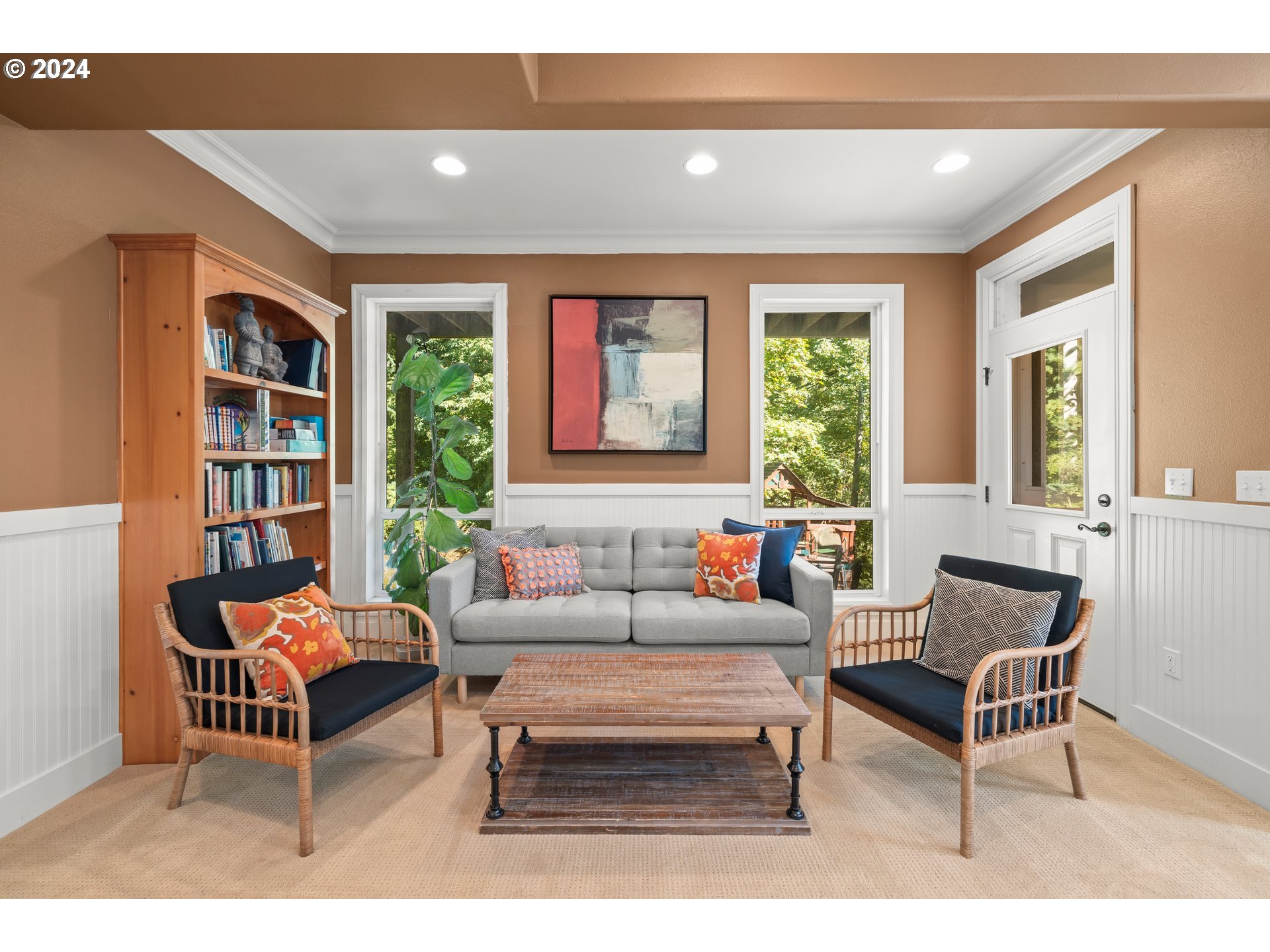 2534 Northwest Rhodes Lane Portland, OR 97229 - Photo 28 of 41 a living room with furniture and a book shelf