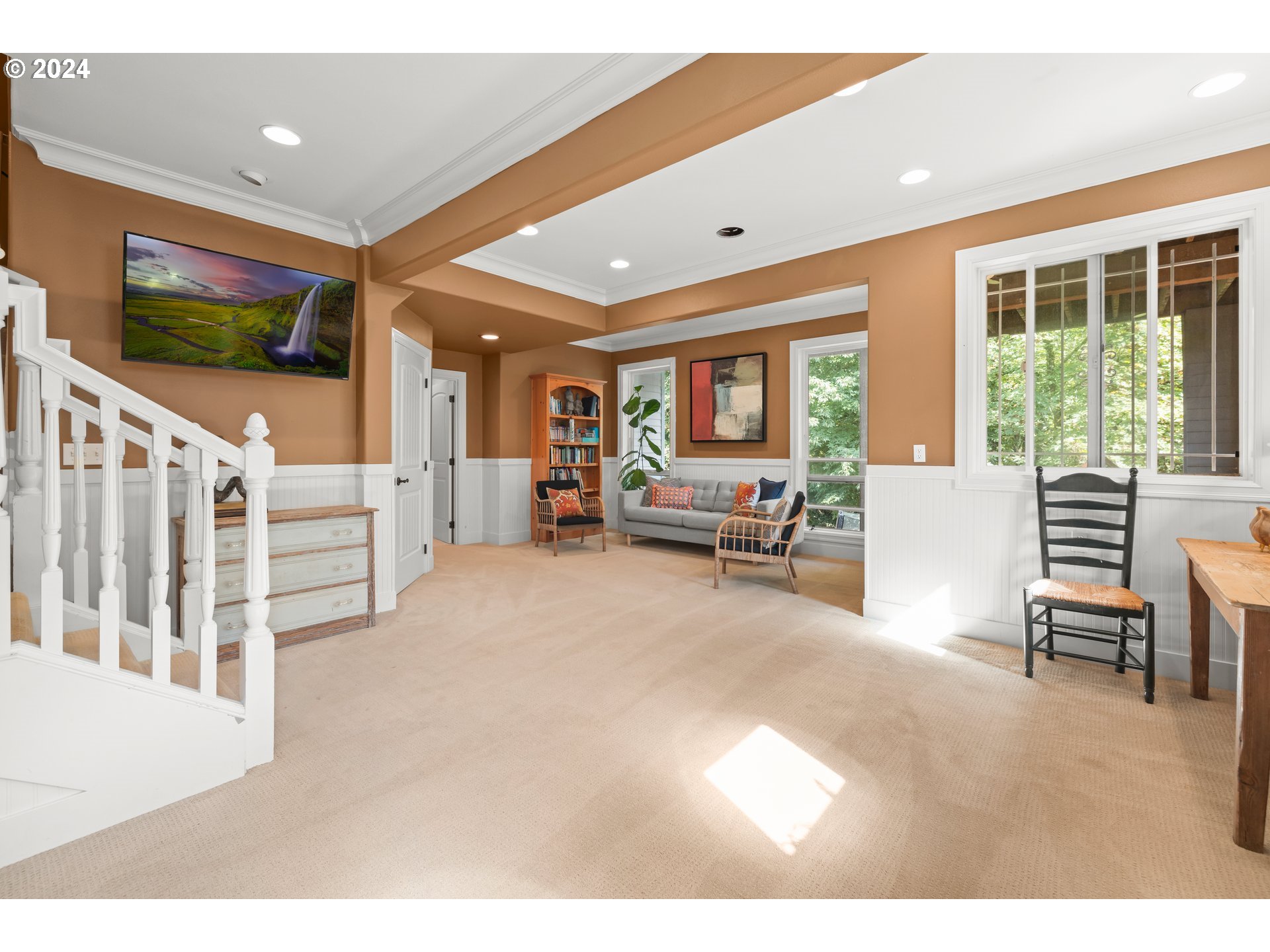 2534 Northwest Rhodes Lane Portland, OR 97229 - Photo 31 of 41 a living room with furniture and a flat screen tv