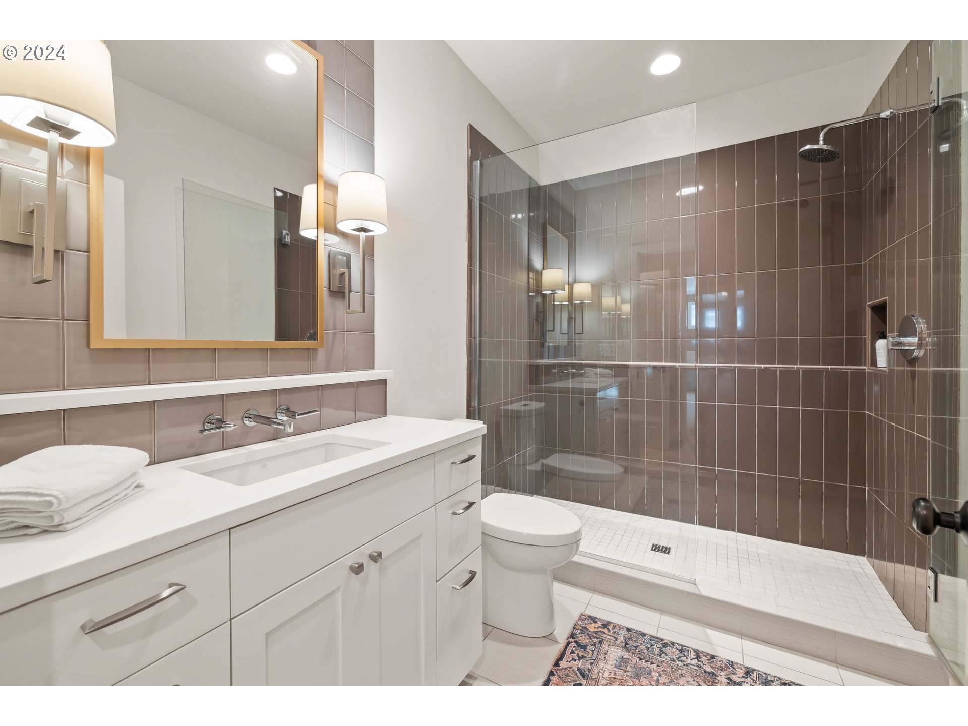 2534 Northwest Rhodes Lane Portland, OR 97229 - Photo 33 of 41 a bathroom with a sink a toilet and shower