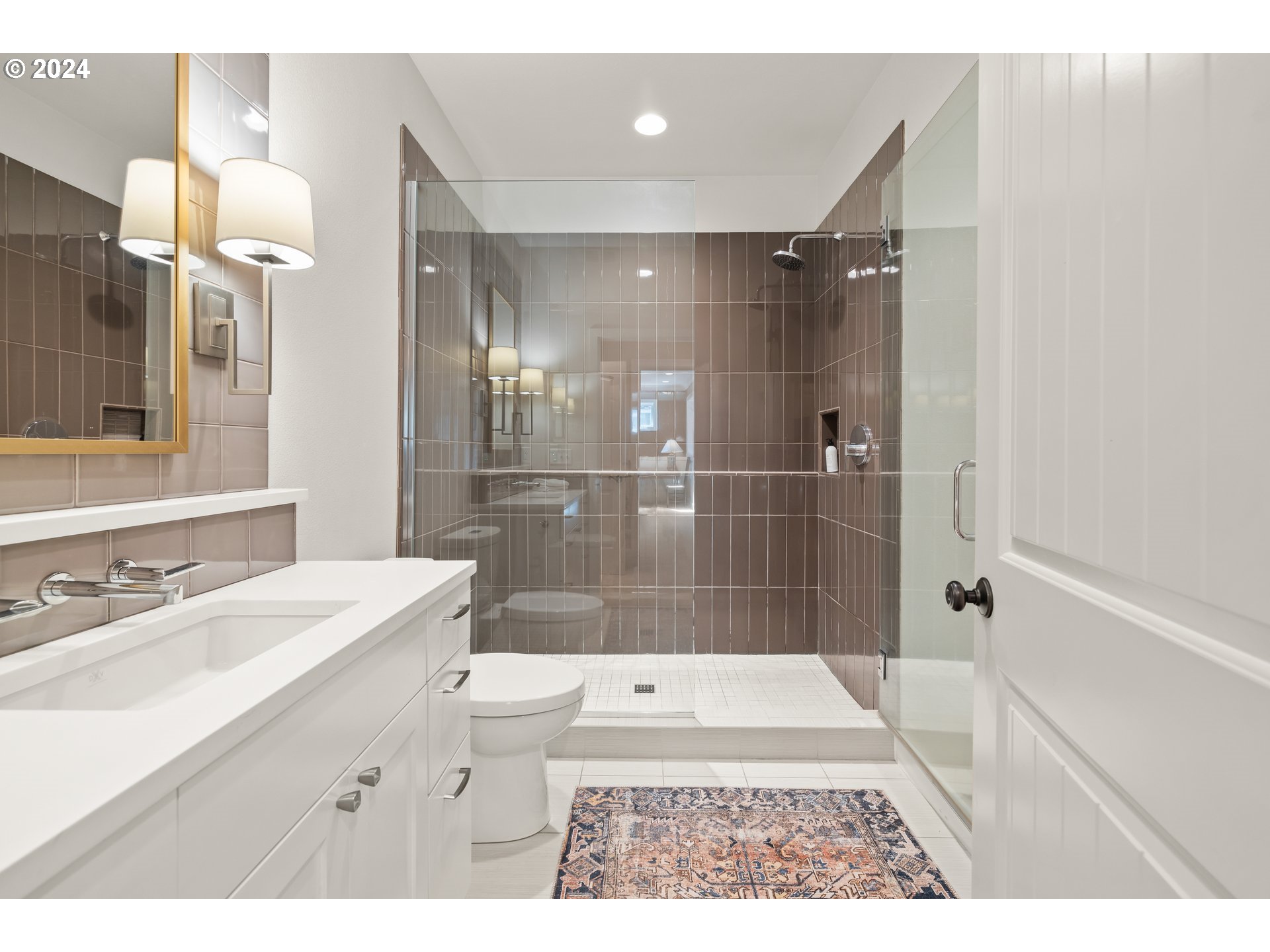 2534 Northwest Rhodes Lane Portland, OR 97229 - Photo 34 of 41 a bathroom with a sink a toilet a mirror and shower