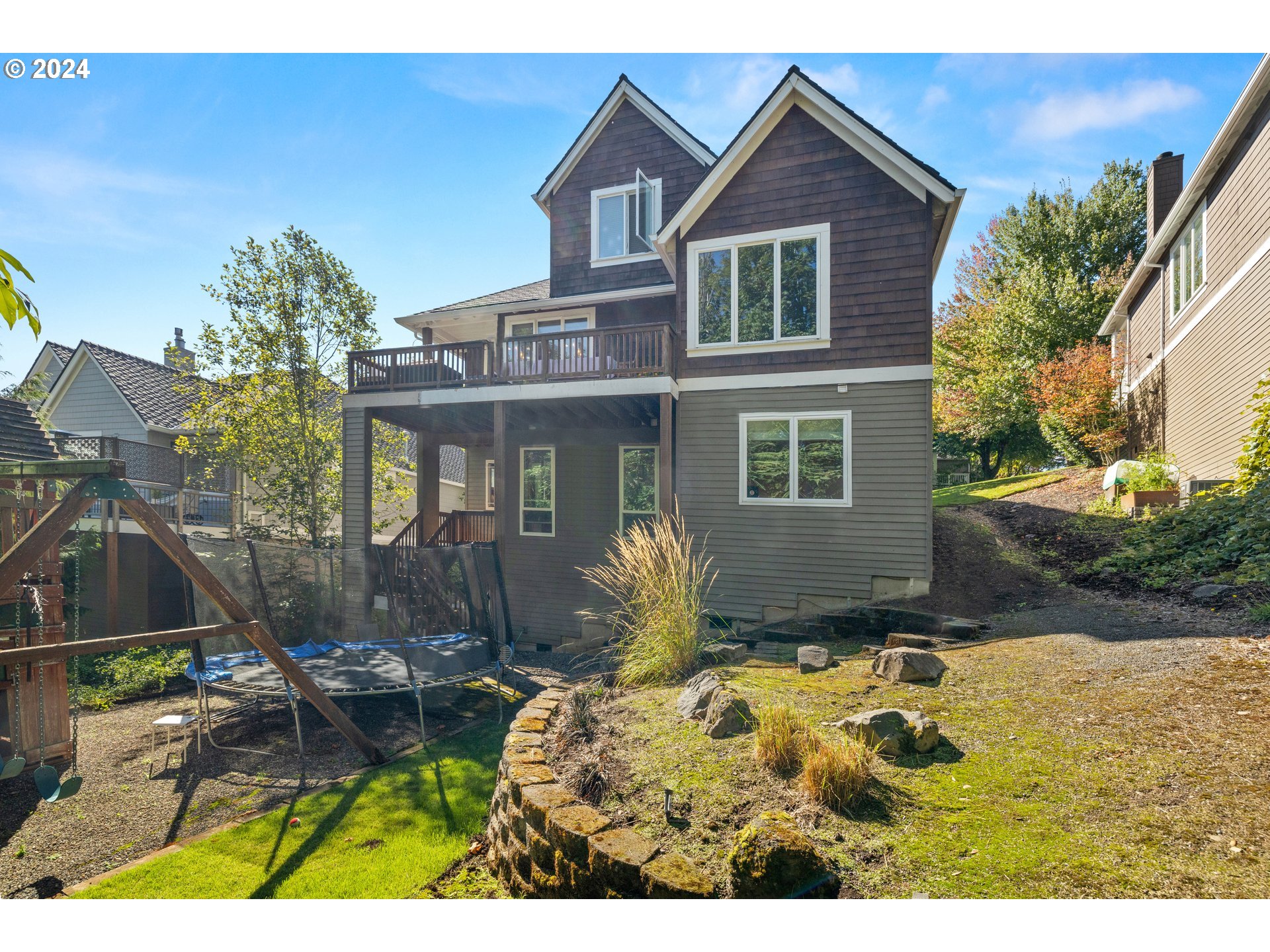 2534 Northwest Rhodes Lane Portland, OR 97229 - Photo 40 of 41 a view of a house with backyard and sitting area