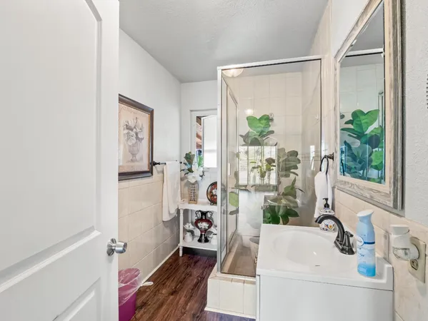a bathroom with a sink a vanity and a mirror