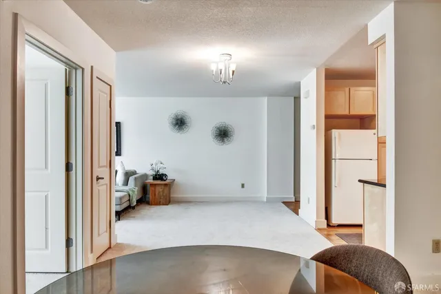 a kitchen with stainless steel appliances granite countertop a stove a sink a refrigerator and a granite counter tops