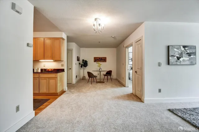 a table with chairs and a potted plant