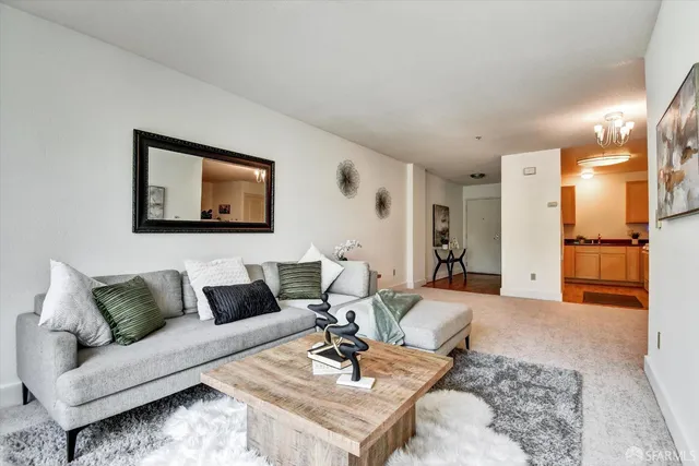 a view of a livingroom with furniture and hardwood floor