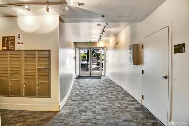 a view of a hallway with a chandelier