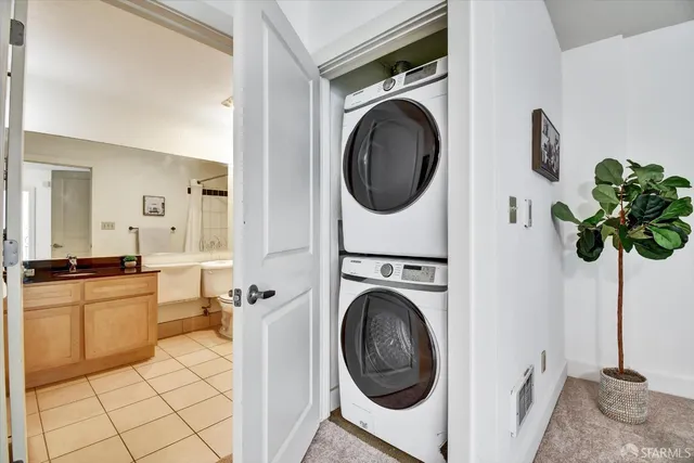 a spacious bathroom with a bathtub shower sink mirror and toilet