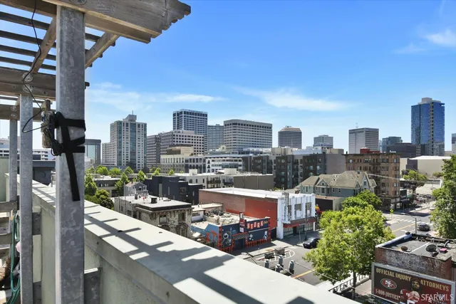 a roof deck with a table and chairs