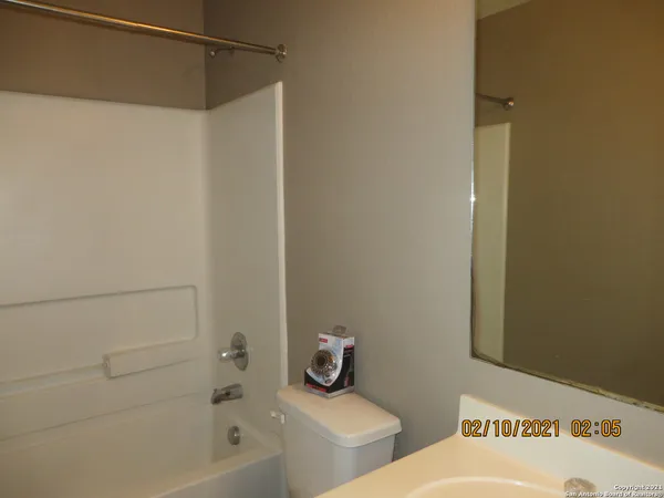 a bathroom with a bathtub and shower