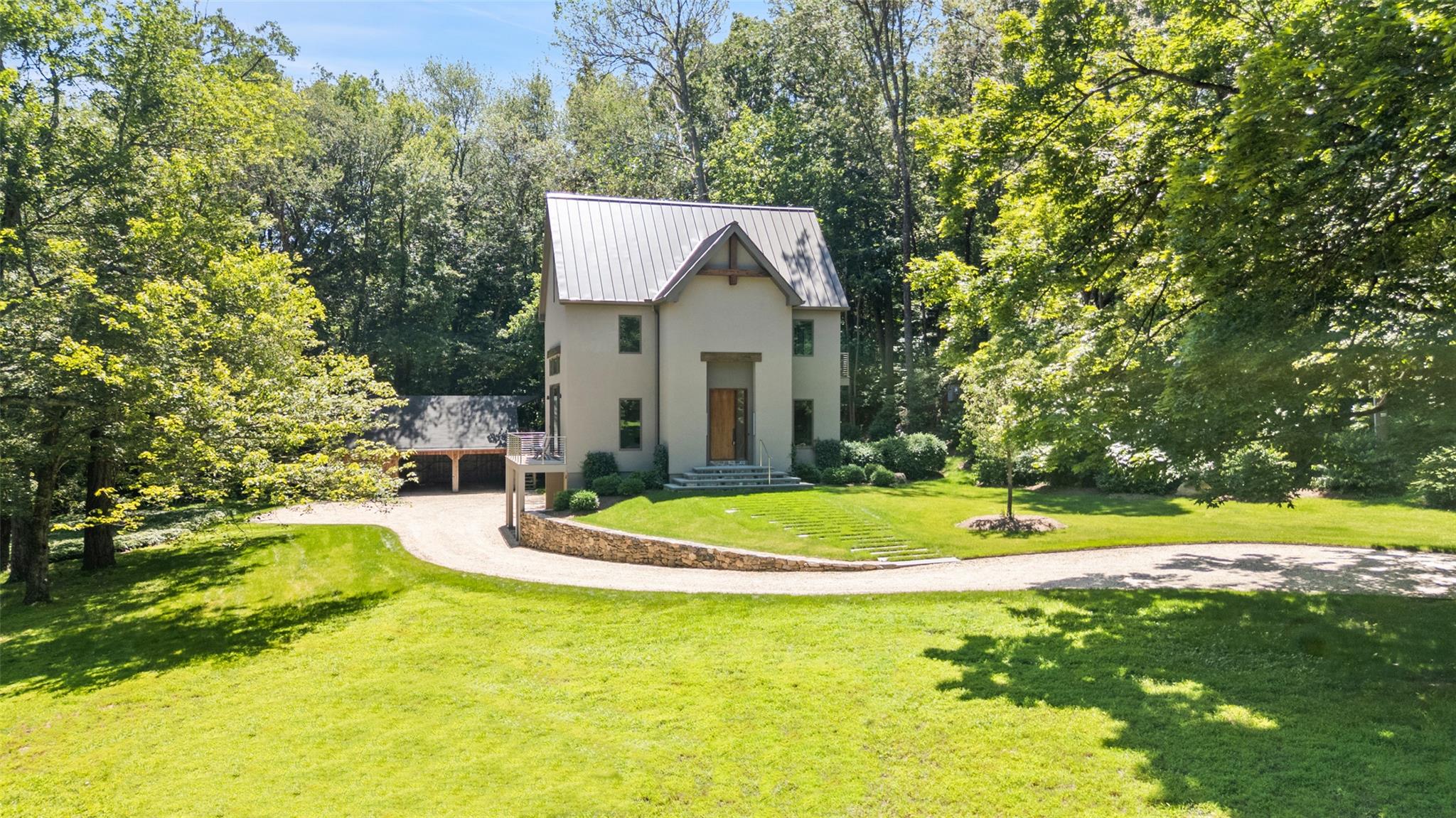 26 Pound Ridge Road Pound Ridge, NY 10576 - Photo 1 of 1 a white house with a big yard and large trees