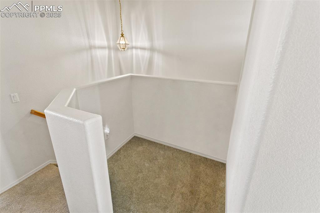 7022 Sand Crest View Colorado Springs, CO 80923 - Photo 12 of 13 an empty room with a window