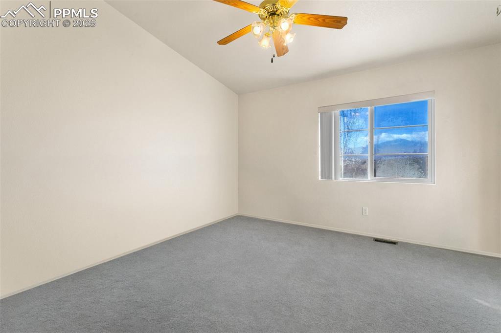 7022 Sand Crest View Colorado Springs, CO 80923 - Photo 8 of 13 an empty room with a window