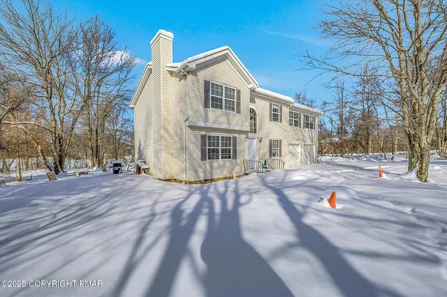 a view of a patio with iron fence