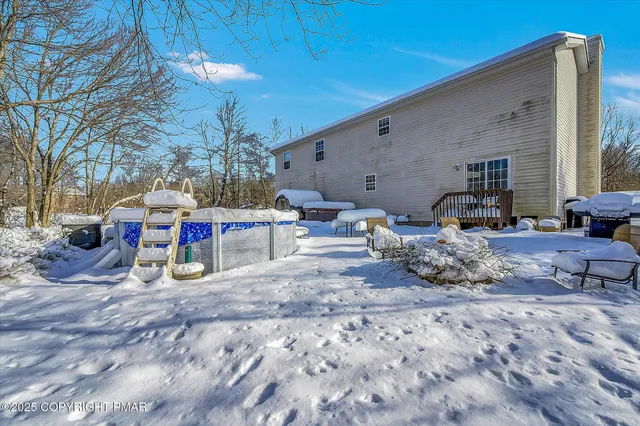 a kitchen with a refrigerator and a stove top oven