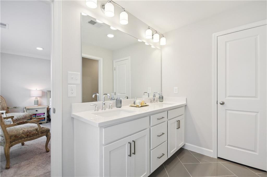 765 Trevett Way Marietta, GA 30066 - Photo 22 of 44 a en suite bathroom with a double vanity sink and a mirror
