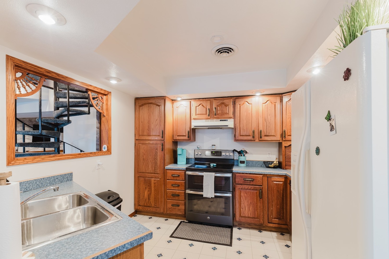 175 Oak Circle Goreville, IL 62939 - Photo 12 of 60 a kitchen that has a sink cabinets counter space and stainless steel appliances