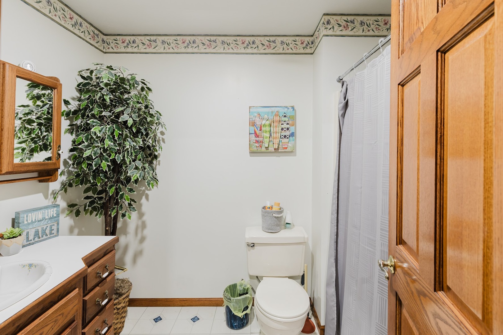 175 Oak Circle Goreville, IL 62939 - Photo 22 of 60 a bathroom with a toilet a sink and a shower curtain