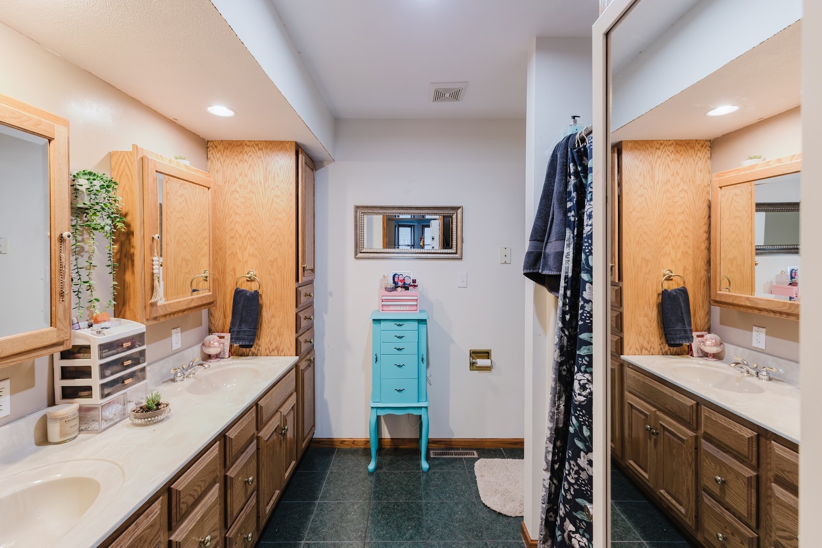 175 Oak Circle Goreville, IL 62939 - Photo 28 of 60 a spacious bathroom with a double vanity sink a mirror and a shower