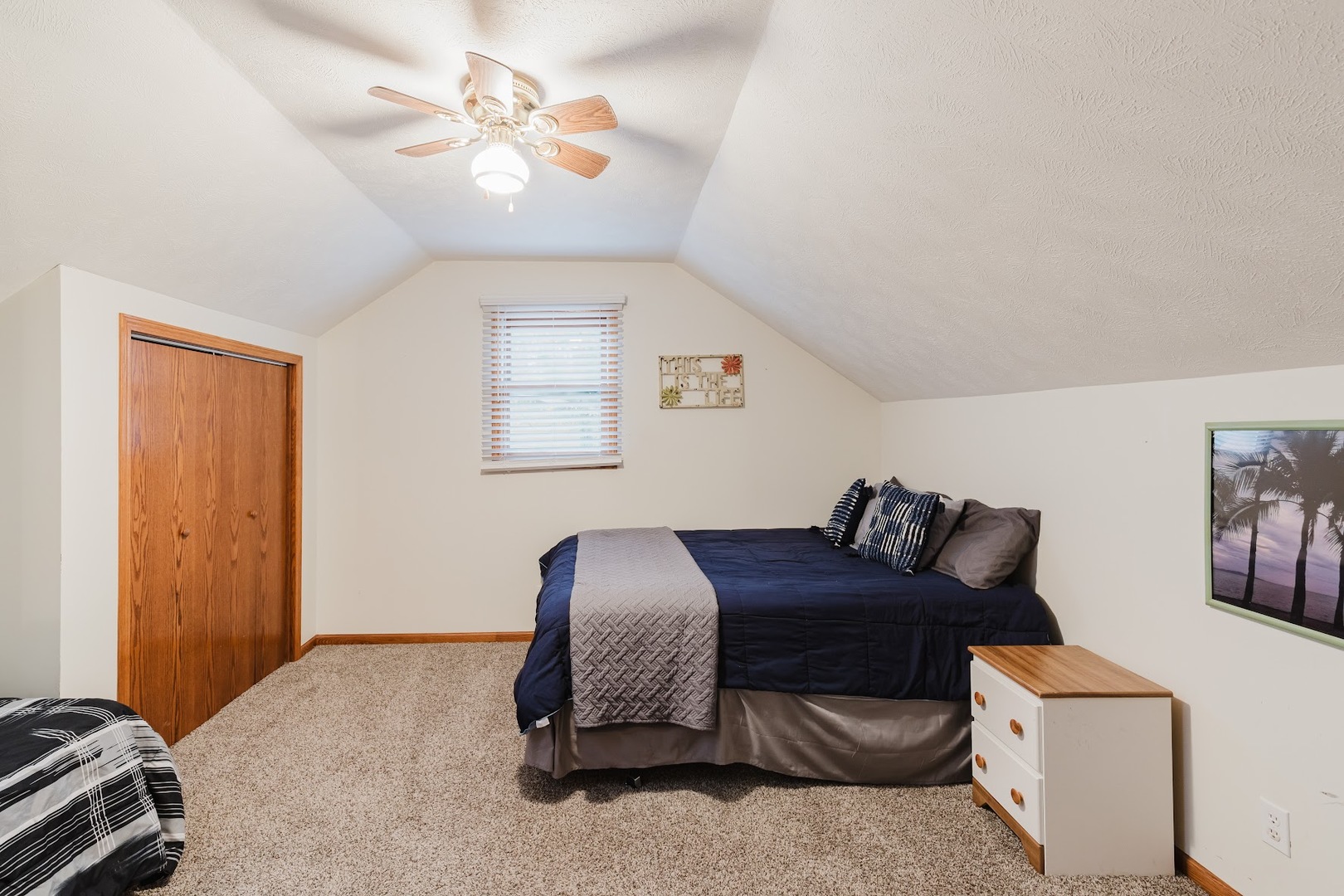 175 Oak Circle Goreville, IL 62939 - Photo 43 of 60 a bedroom with a bed and a chandelier