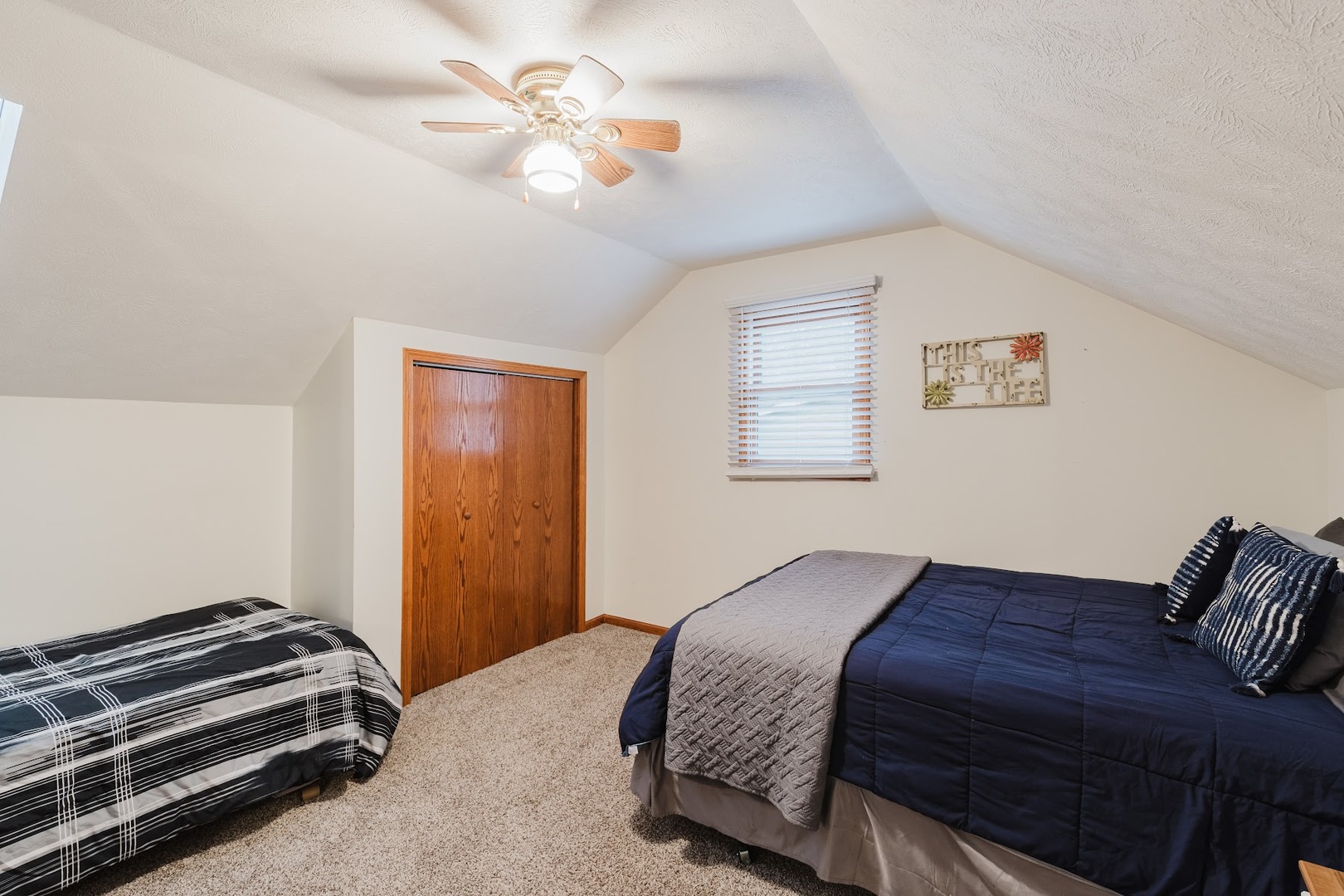 175 Oak Circle Goreville, IL 62939 - Photo 44 of 60 a bedroom with a bed and a chandelier