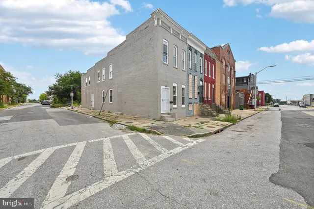 a view of a street with a building