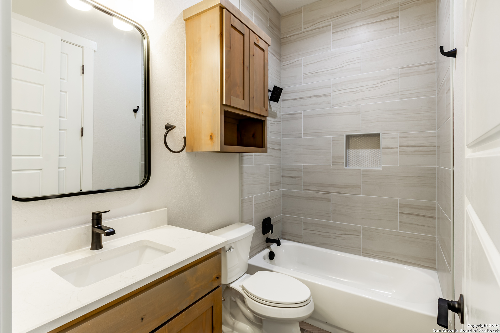 246 Timber Place La Vernia, TX 78121 - Photo 20 of 33 a bathroom with a sink a toilet and bathtub